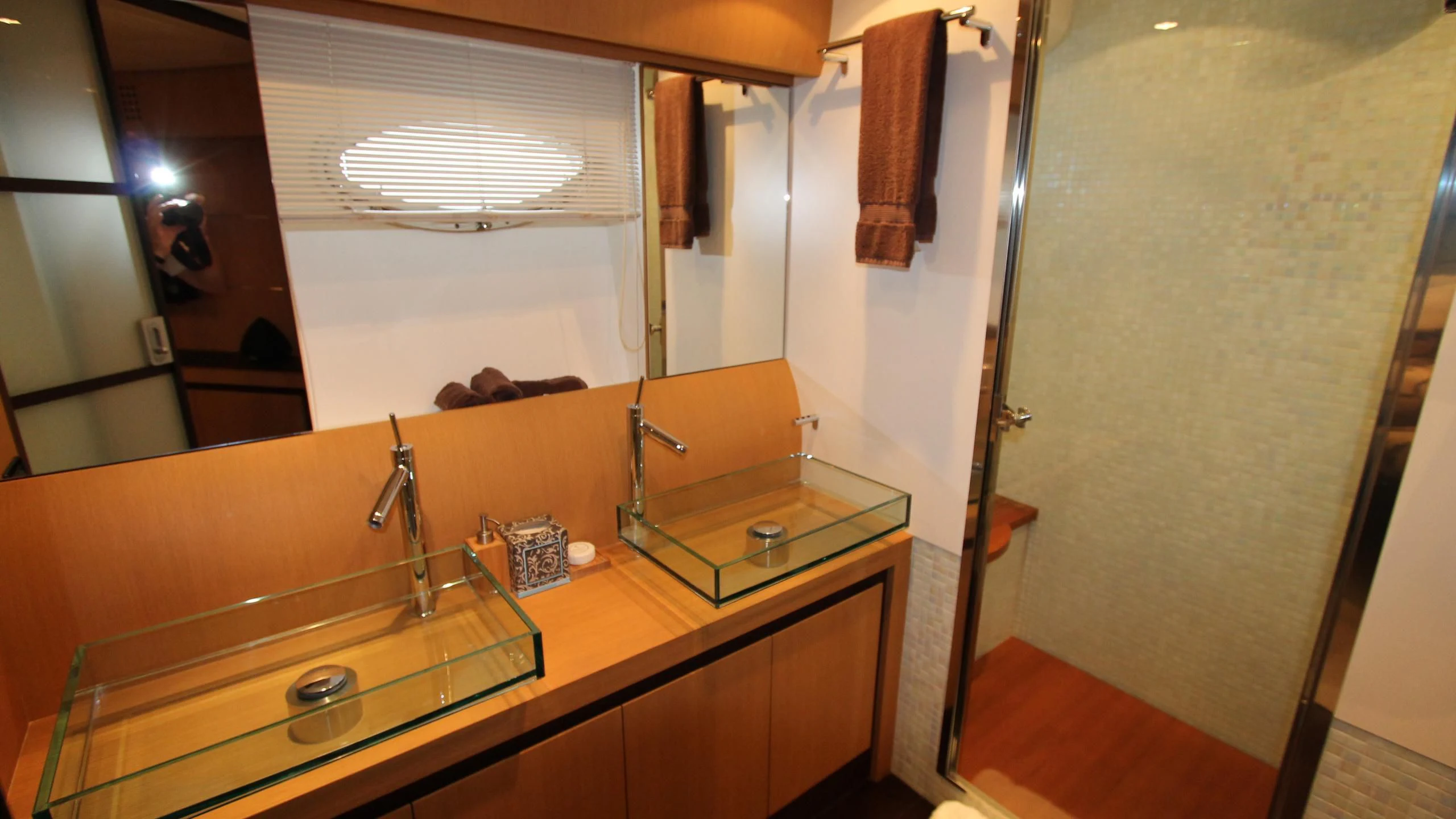 a bathroom with a countertop sink and a shower aboard A&O Yacht for Sale