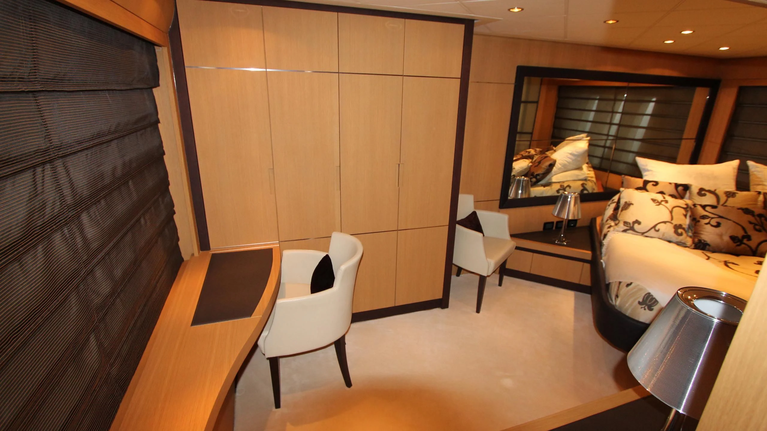 a room with a bed and a desk aboard A&O Yacht for Sale