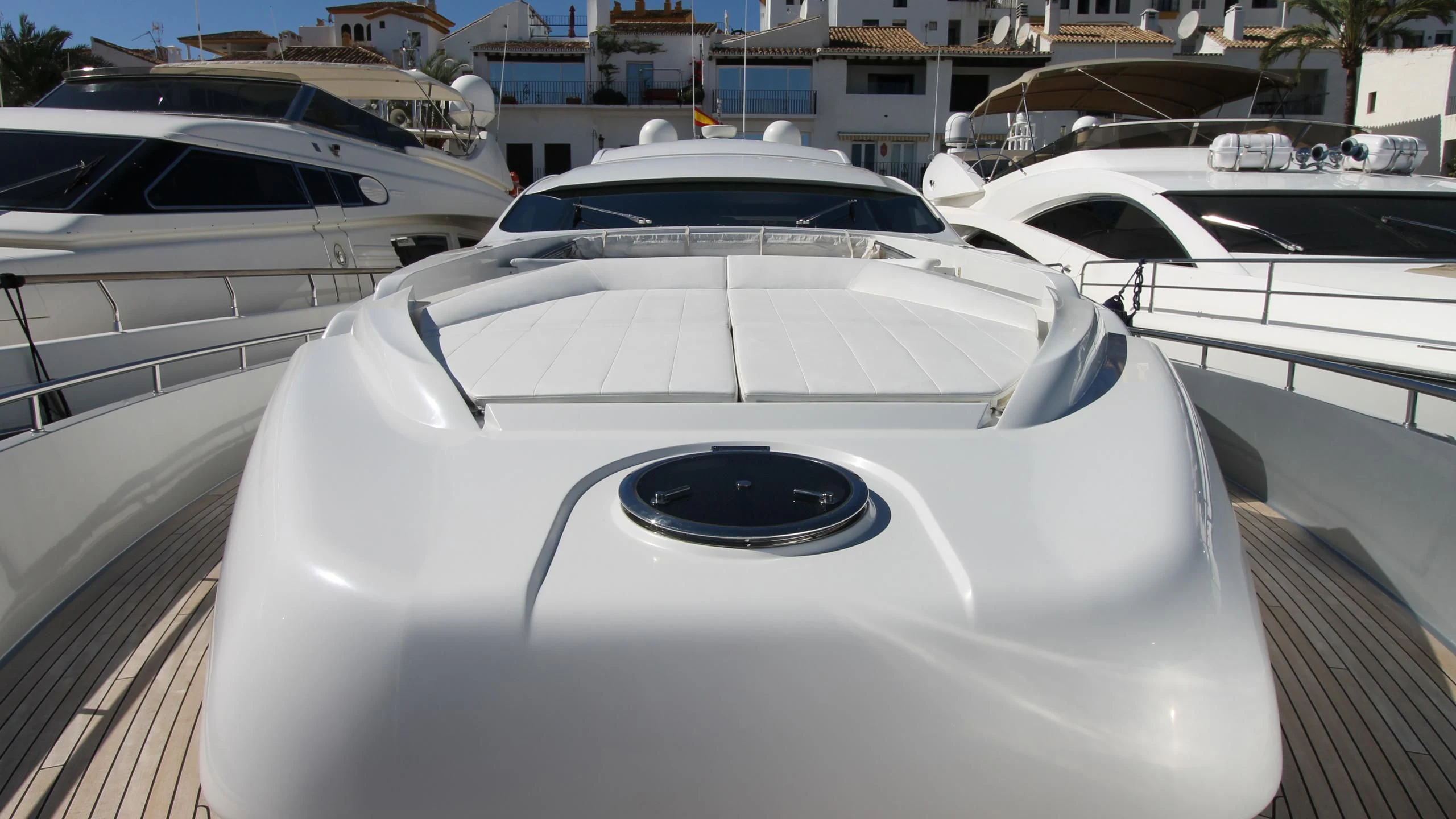 a white car parked in a parking lot aboard A&O Yacht for Sale