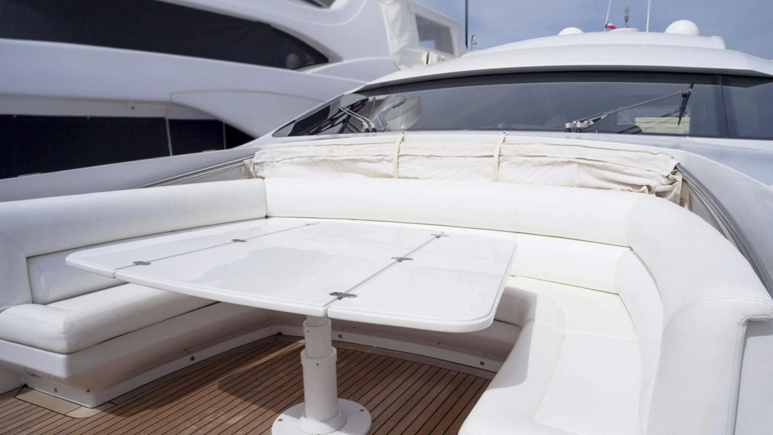 a white car with a white interior aboard A&O Yacht for Sale