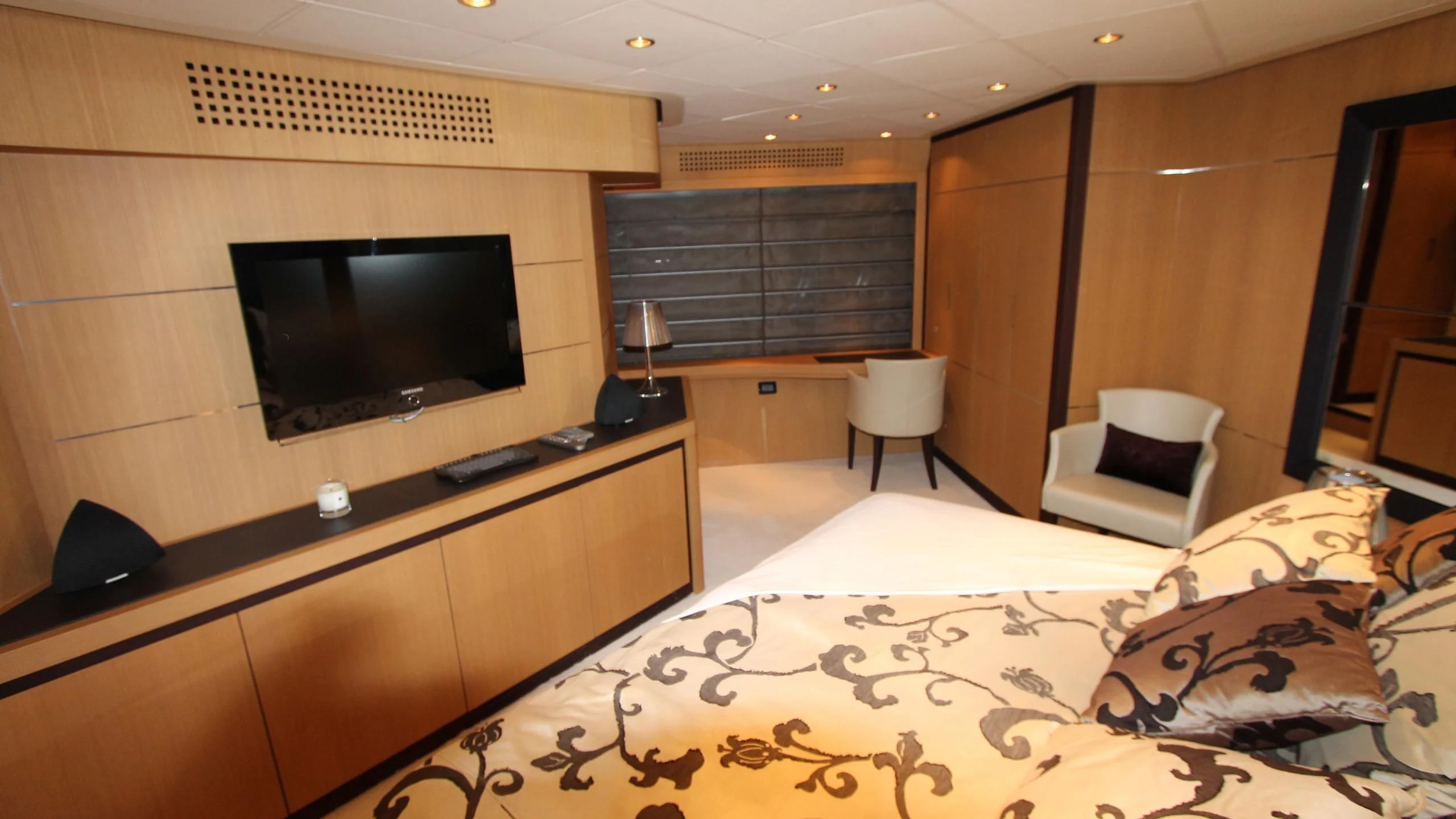 a hotel room with a tv and a bed aboard A&O Yacht for Sale