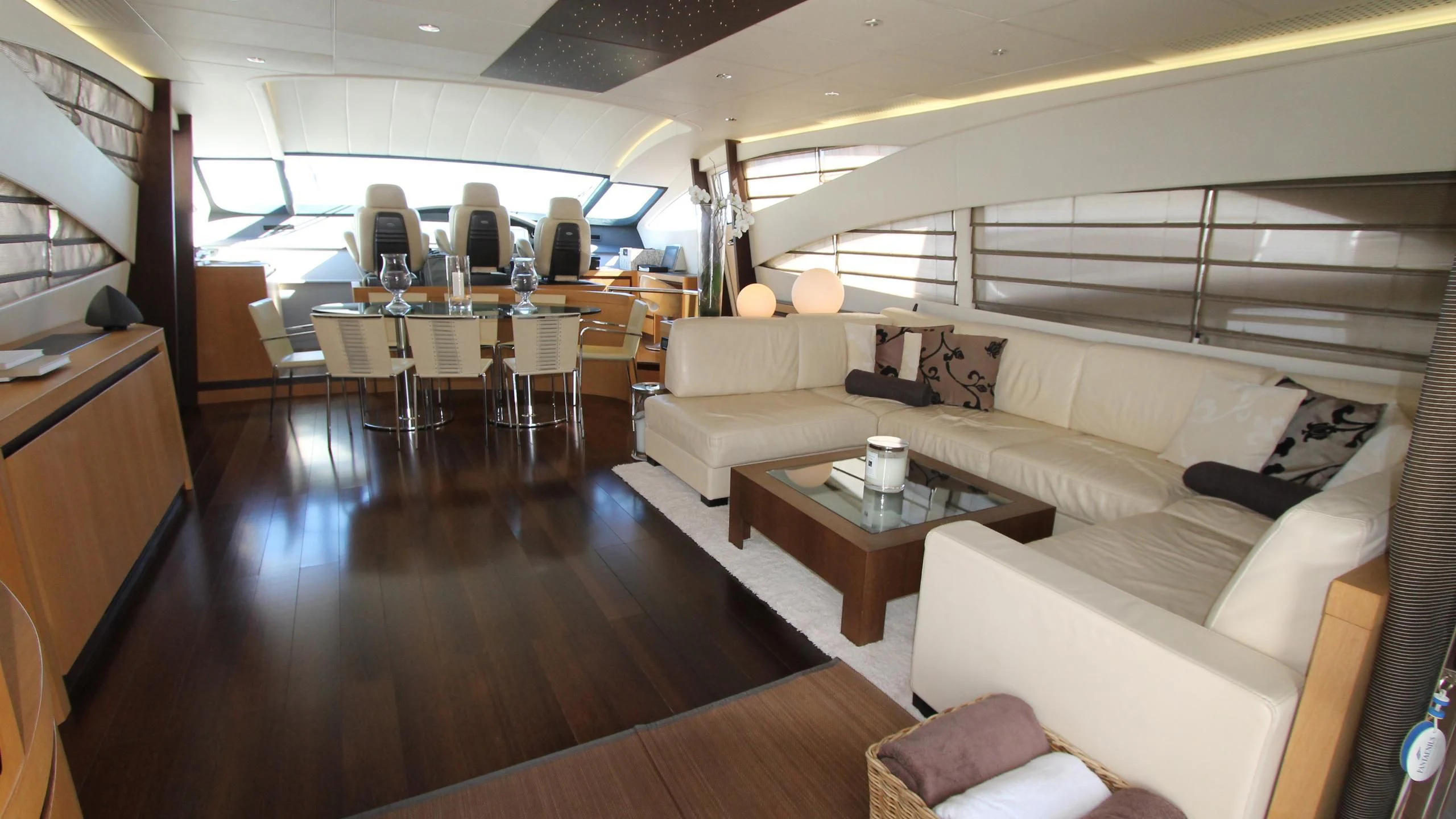 a living room with a couch and a table aboard A&O Yacht for Sale