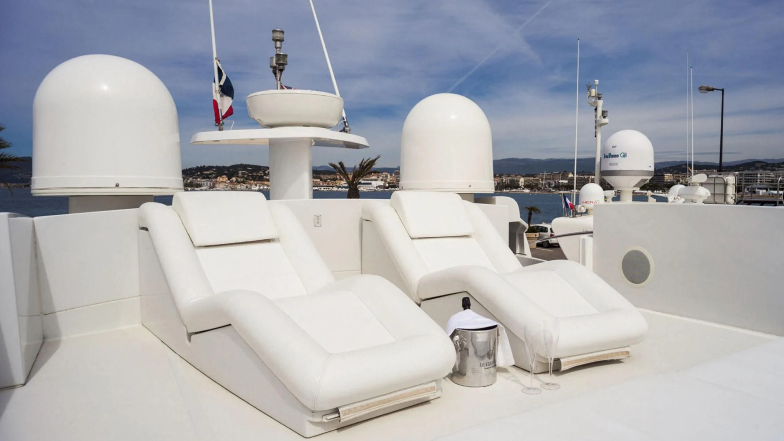 a room with white chairs and white domes aboard A&O Yacht for Sale