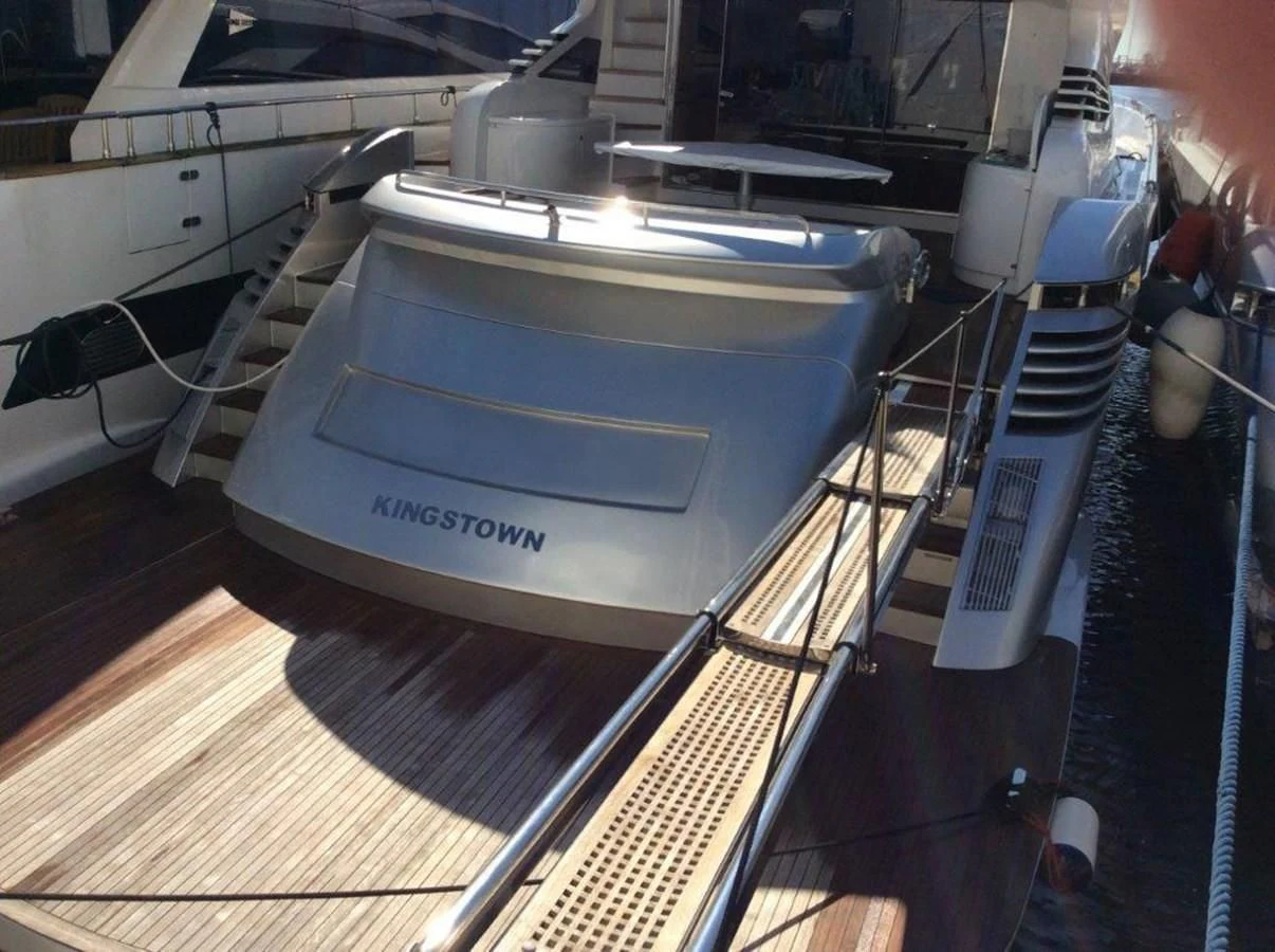 a white guitar on a wooden floor aboard A&O Yacht for Sale
