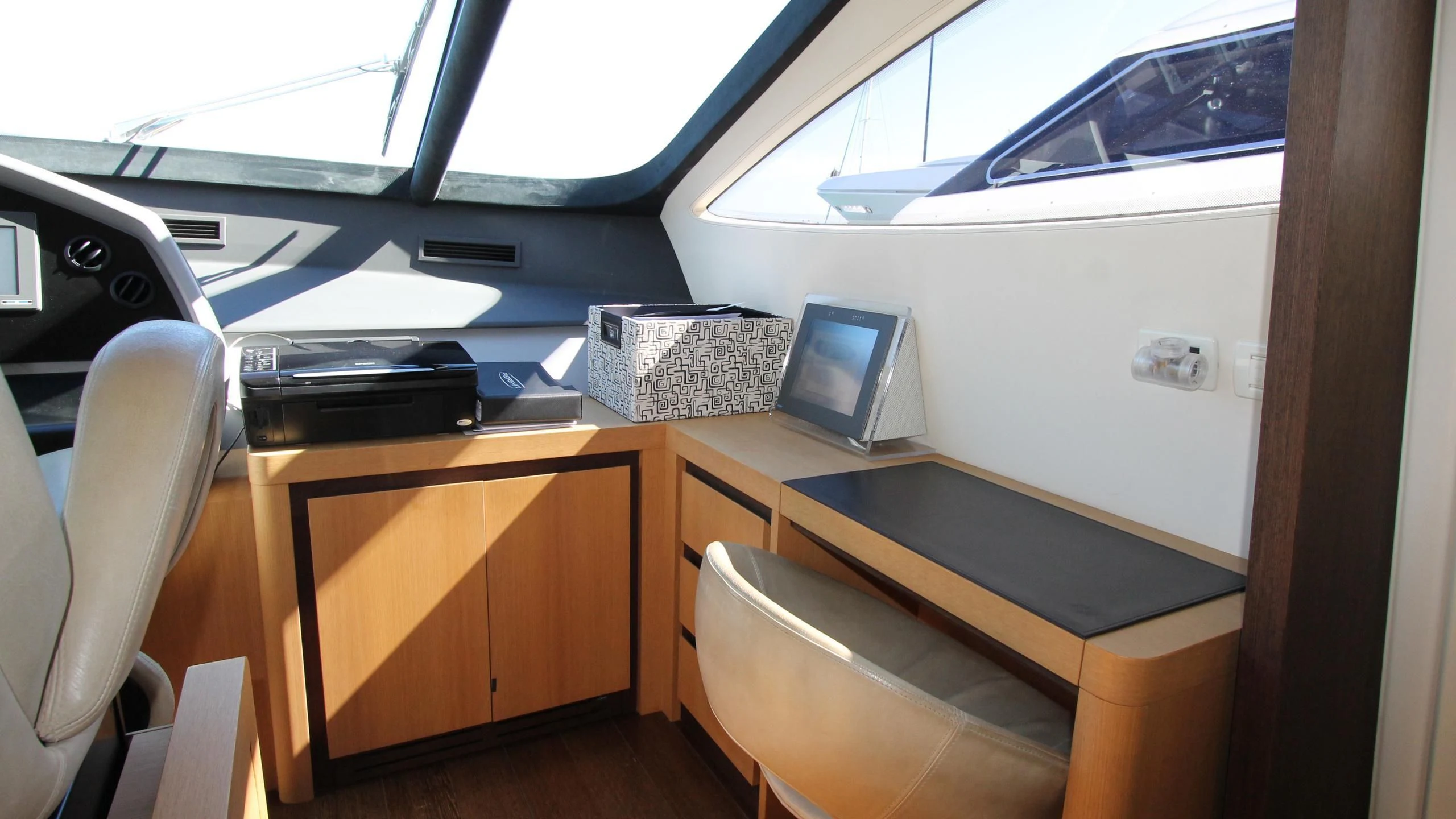 a room with a desk and computer aboard A&O Yacht for Sale