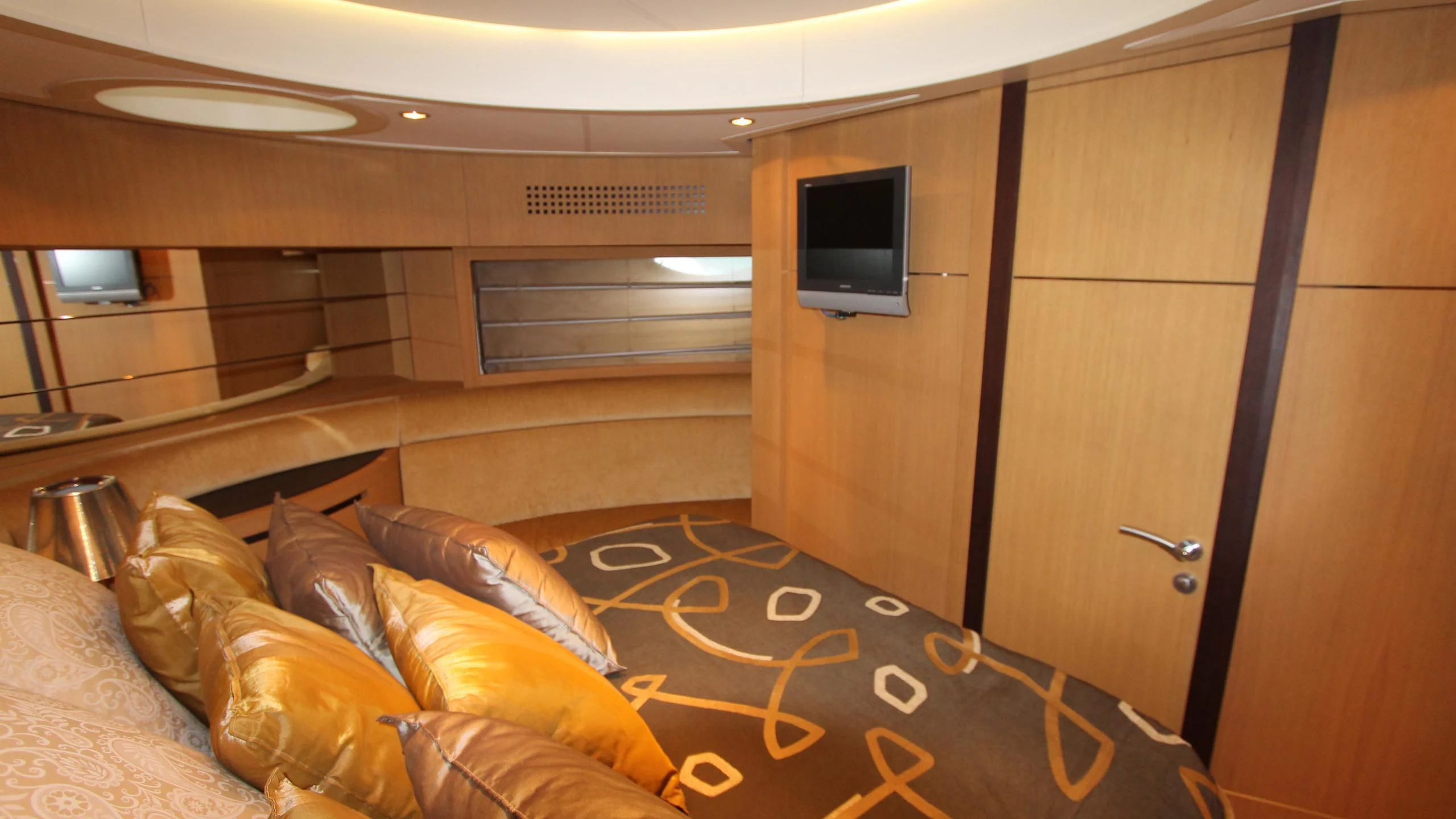 a room with a tv and a bed aboard A&O Yacht for Sale