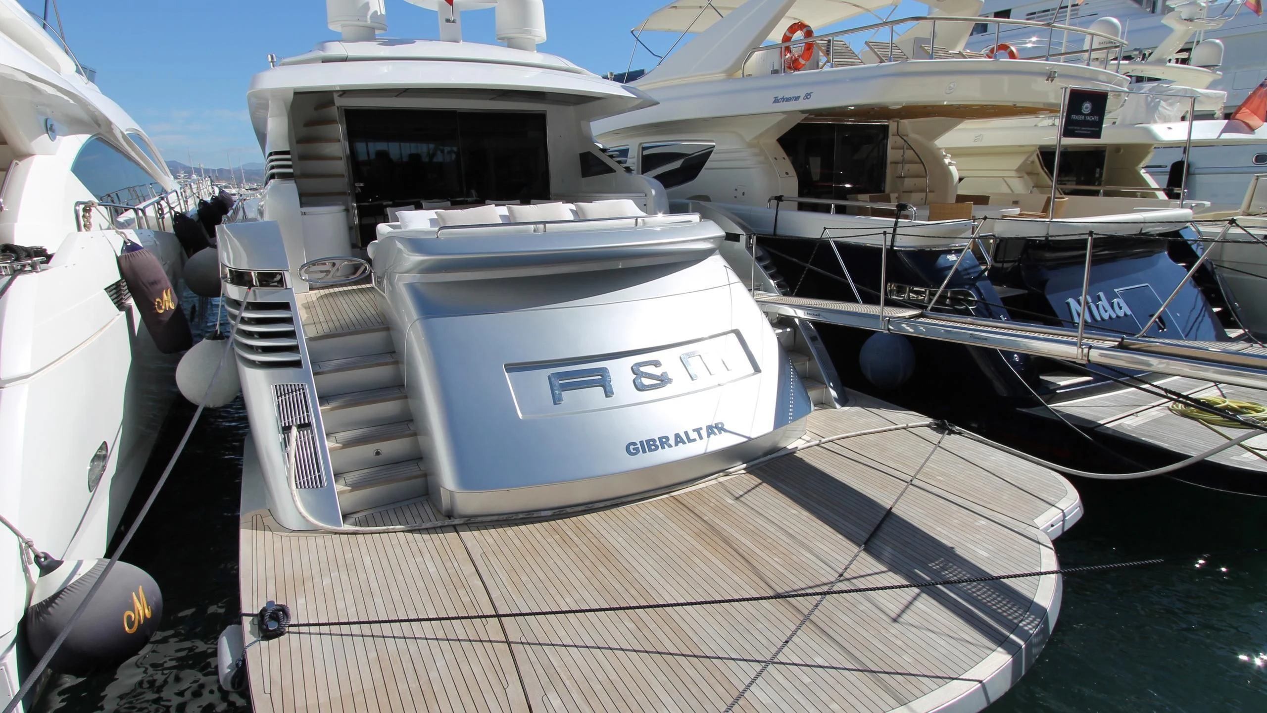 a row of boats on a dock aboard A&O Yacht for Sale