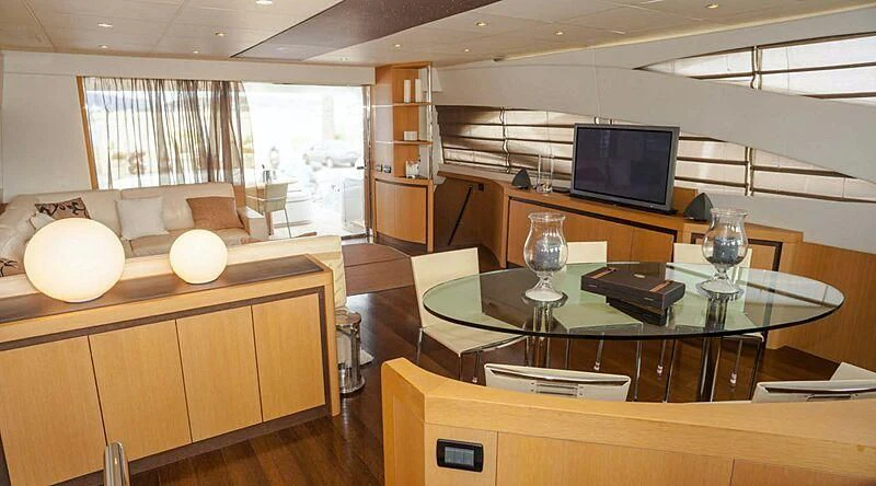 a room with a table and chairs aboard A&O Yacht for Sale