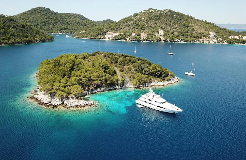 a small island with a few boats aboard KATHLEEN ANNE Yacht for Sale