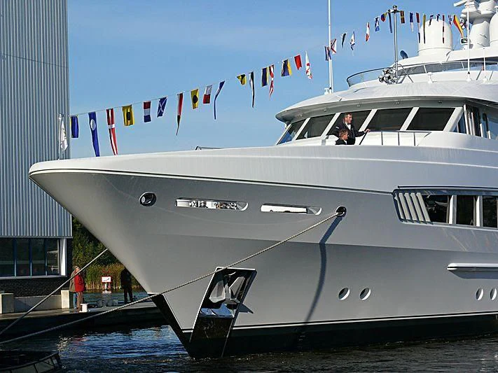 a white boat with flags on it aboard KATHLEEN ANNE Yacht for Sale