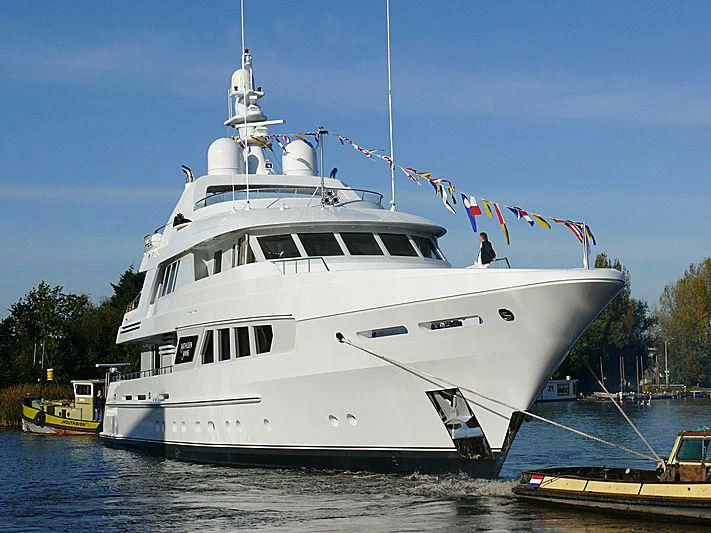 a large white boat with flags on it aboard KATHLEEN ANNE Yacht for Sale