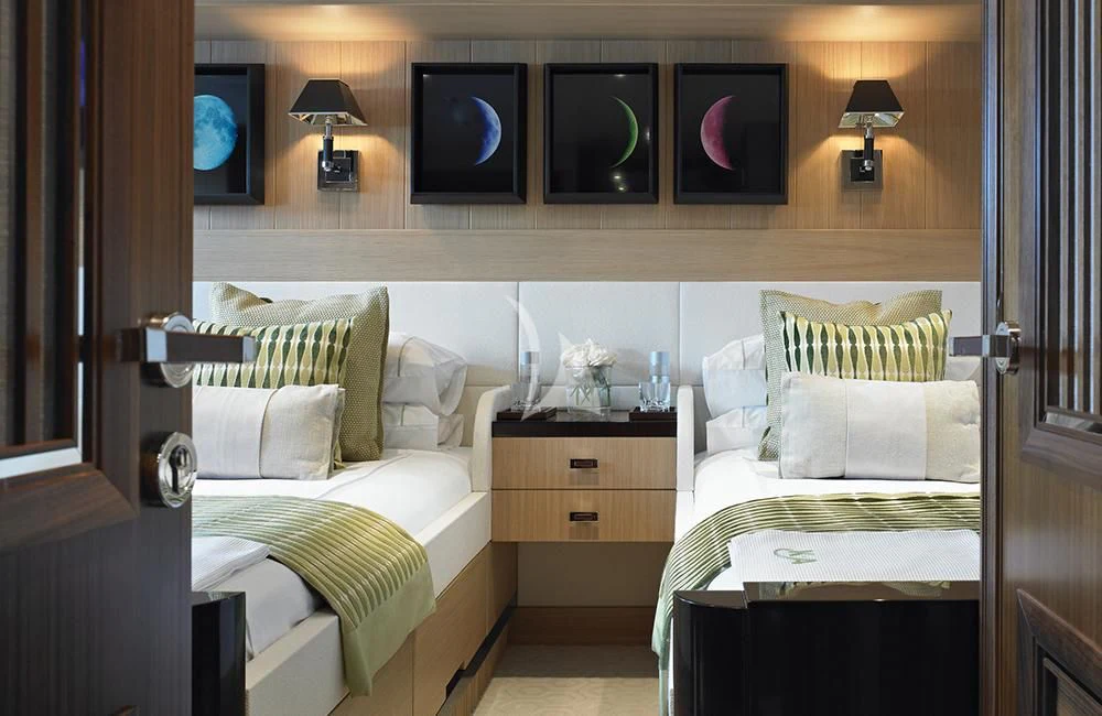 a room with a bed and a television aboard KATHLEEN ANNE Yacht for Sale