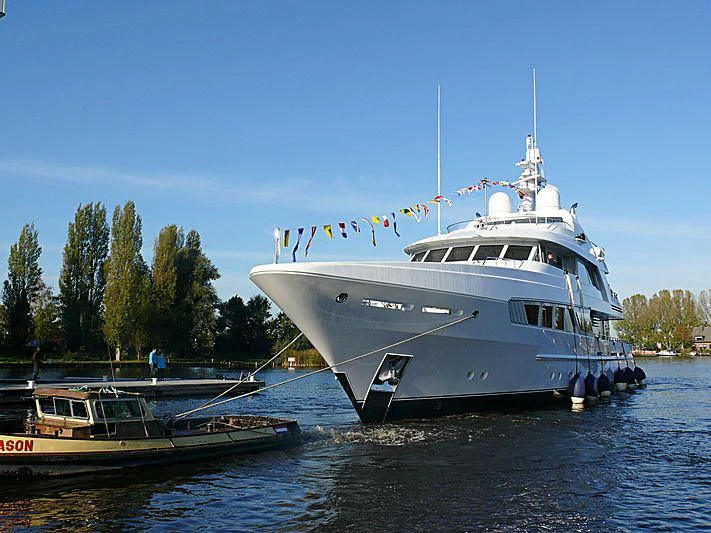 a large white boat on the water aboard KATHLEEN ANNE Yacht for Sale