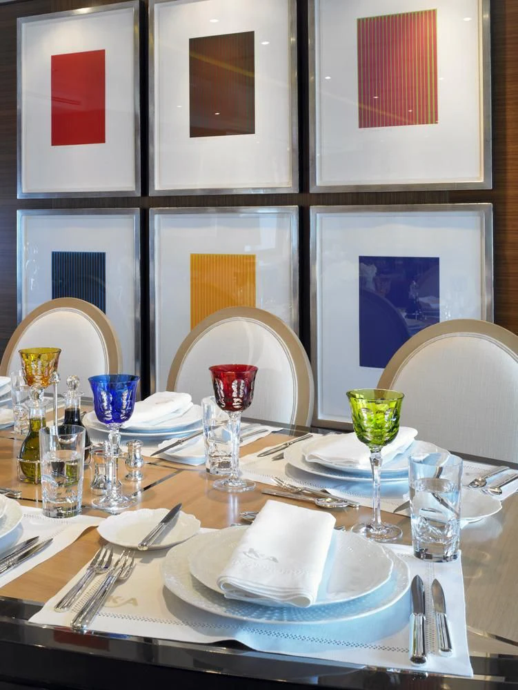 a table with plates and glasses aboard KATHLEEN ANNE Yacht for Sale