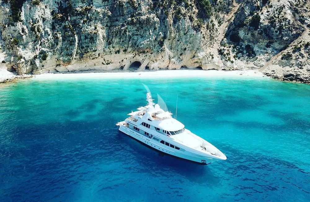 a white boat in the water aboard KATHLEEN ANNE Yacht for Sale
