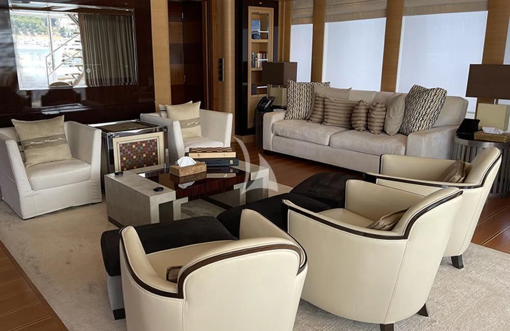 a living room with a couch and a coffee table aboard KATHLEEN ANNE Yacht for Sale