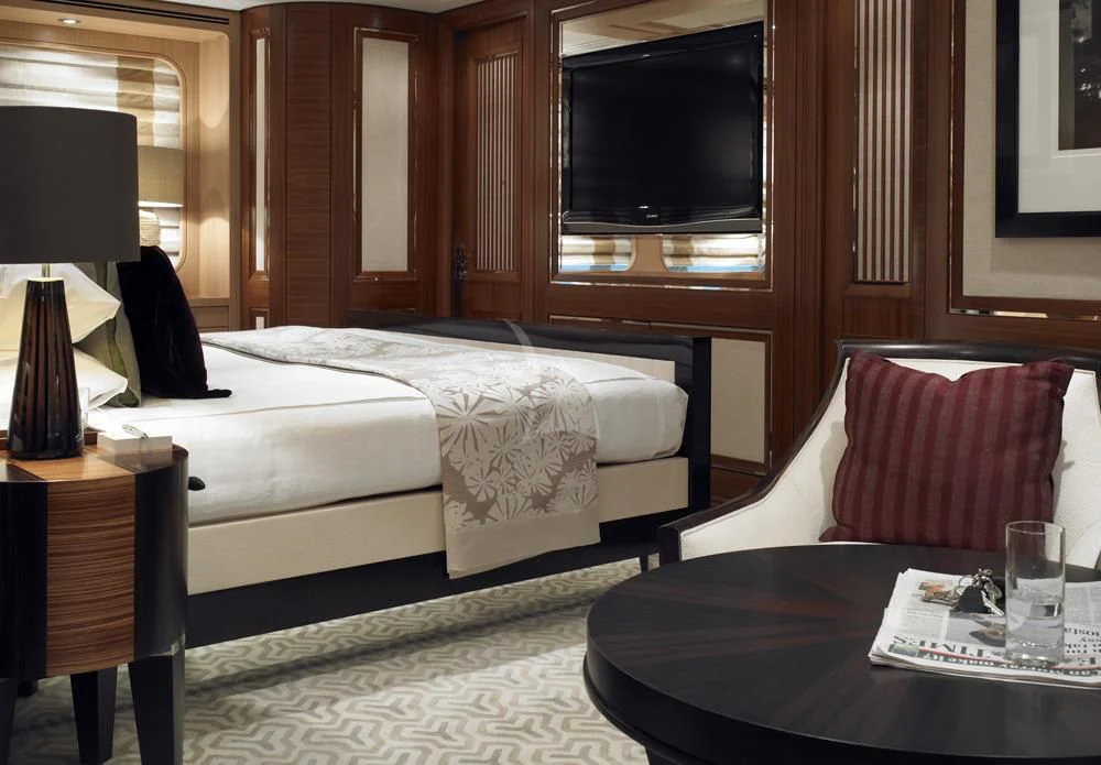 a hotel room with a bed and a television aboard KATHLEEN ANNE Yacht for Sale