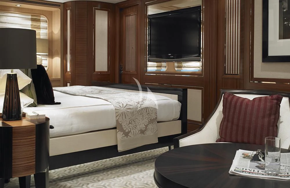 a hotel room with a bed and a television aboard KATHLEEN ANNE Yacht for Sale