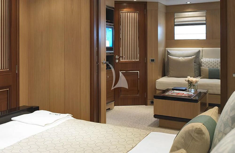 a bedroom with a bed and a door aboard KATHLEEN ANNE Yacht for Sale