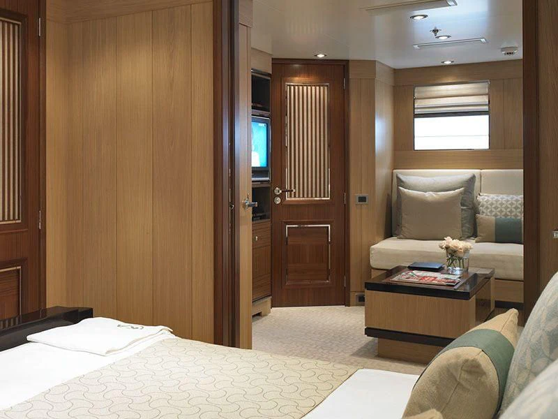 a room with a bed and a couch aboard KATHLEEN ANNE Yacht for Sale
