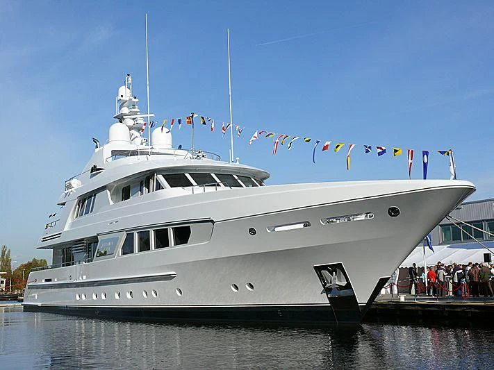 a large white boat with flags on it aboard KATHLEEN ANNE Yacht for Sale