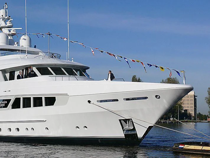 a white boat with flags aboard KATHLEEN ANNE Yacht for Sale