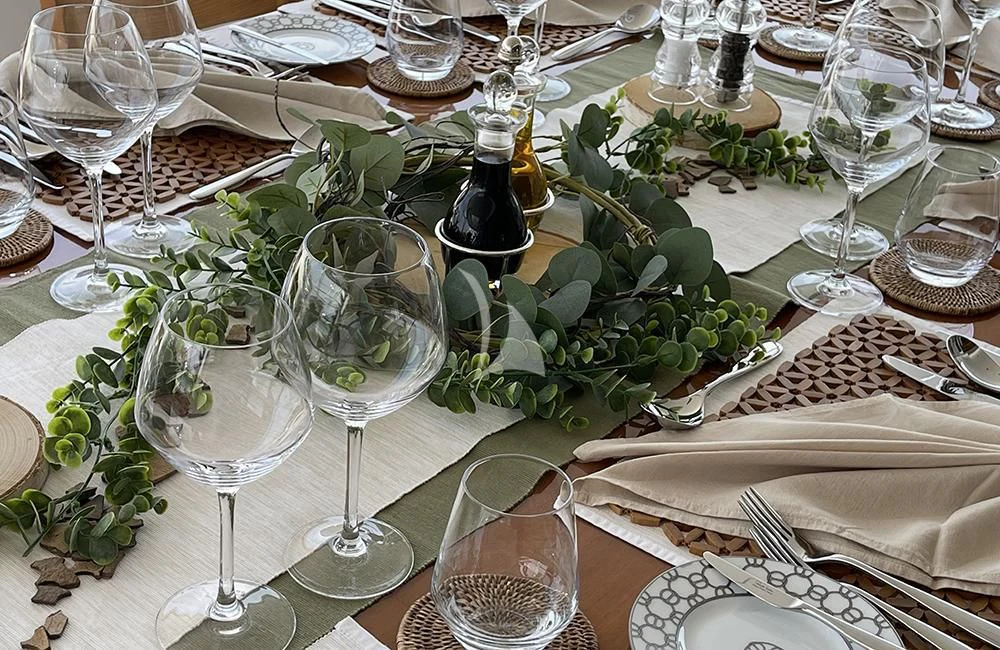a table with wine glasses and plates aboard KATHLEEN ANNE Yacht for Sale