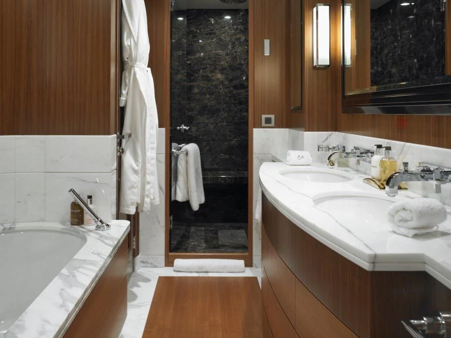 a bathroom with a tub sink and a mirror aboard KATHLEEN ANNE Yacht for Sale