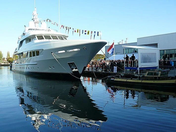 a large white boat docked at a pier aboard KATHLEEN ANNE Yacht for Sale