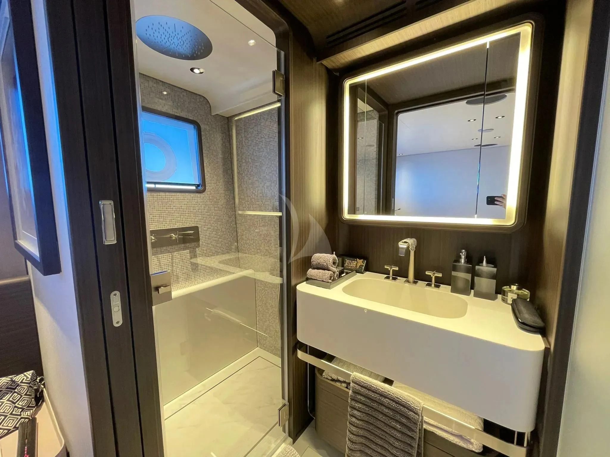a bathroom with a large mirror aboard AT ONE Yacht for Charter