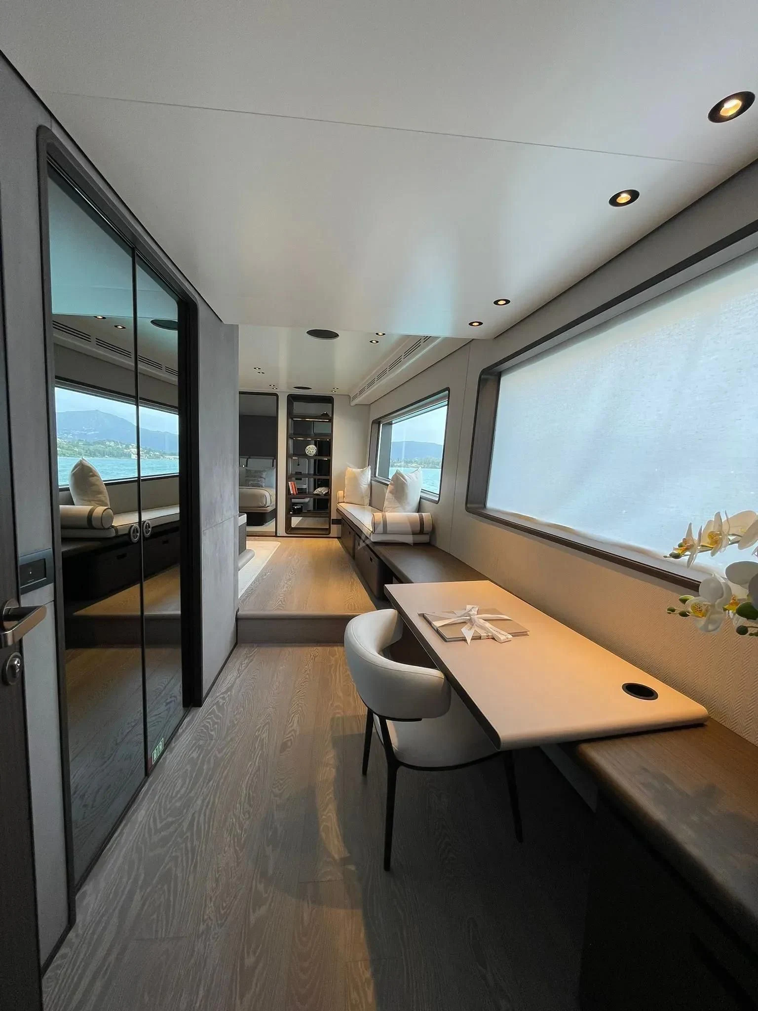 a room with a table and chairs aboard AT ONE Yacht for Charter