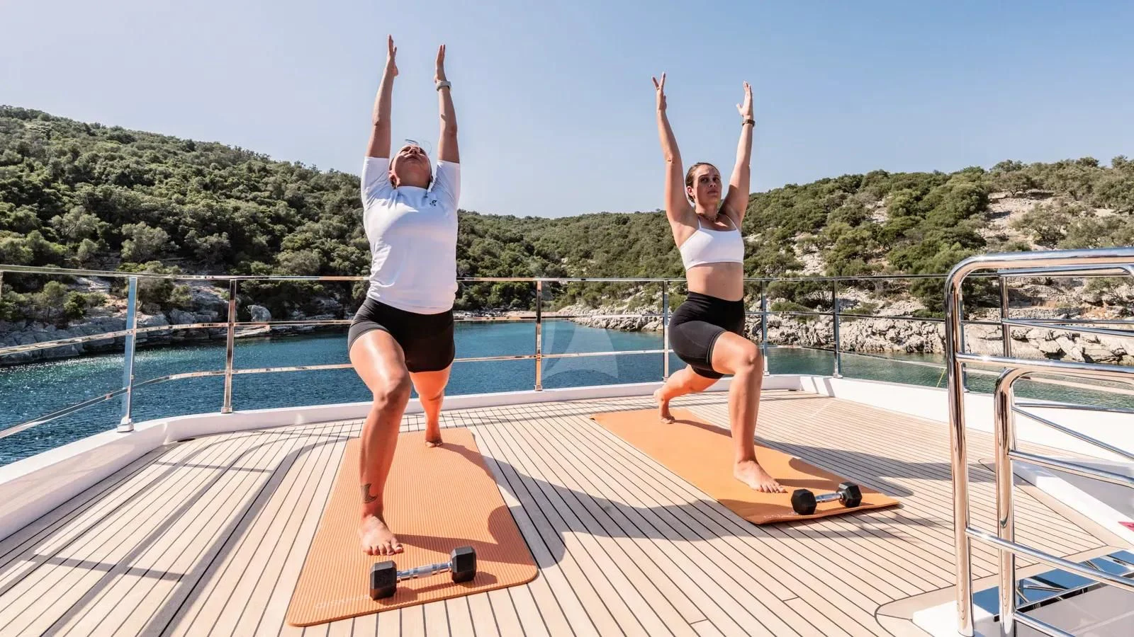 women on a skateboard aboard AT ONE Yacht for Charter