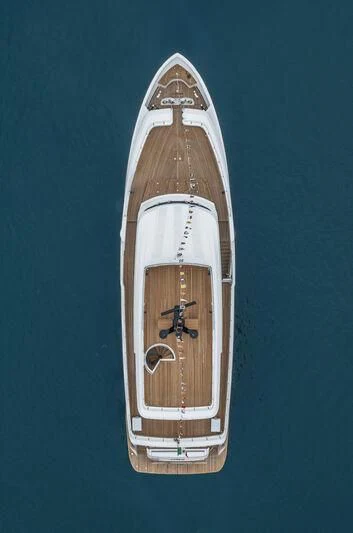 a tall white and gold rocket aboard AT ONE Yacht for Charter