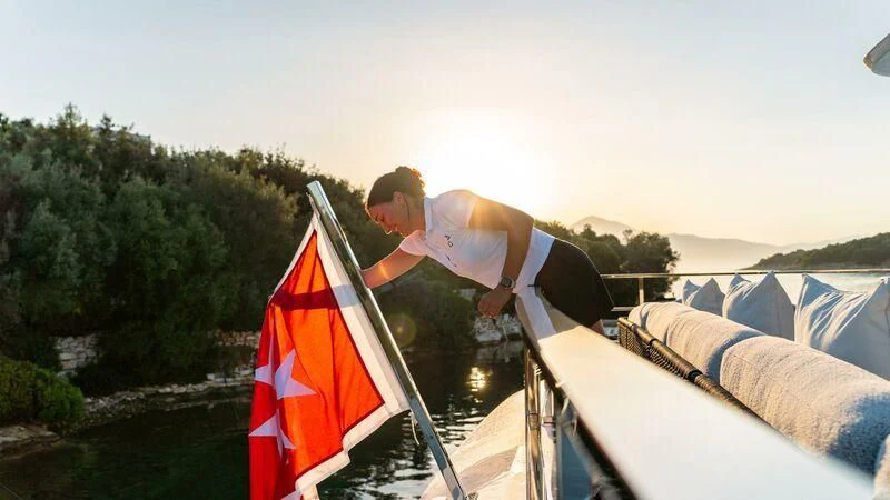 a man on a boat aboard AT ONE Yacht for Charter