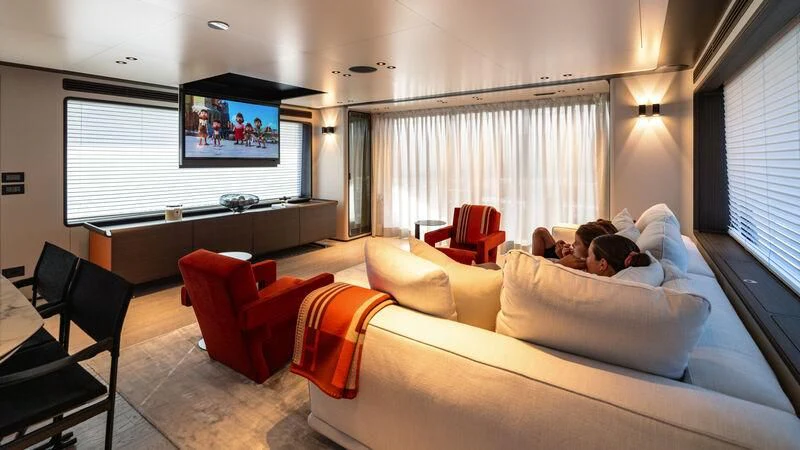 a person lying on a couch aboard AT ONE Yacht for Charter