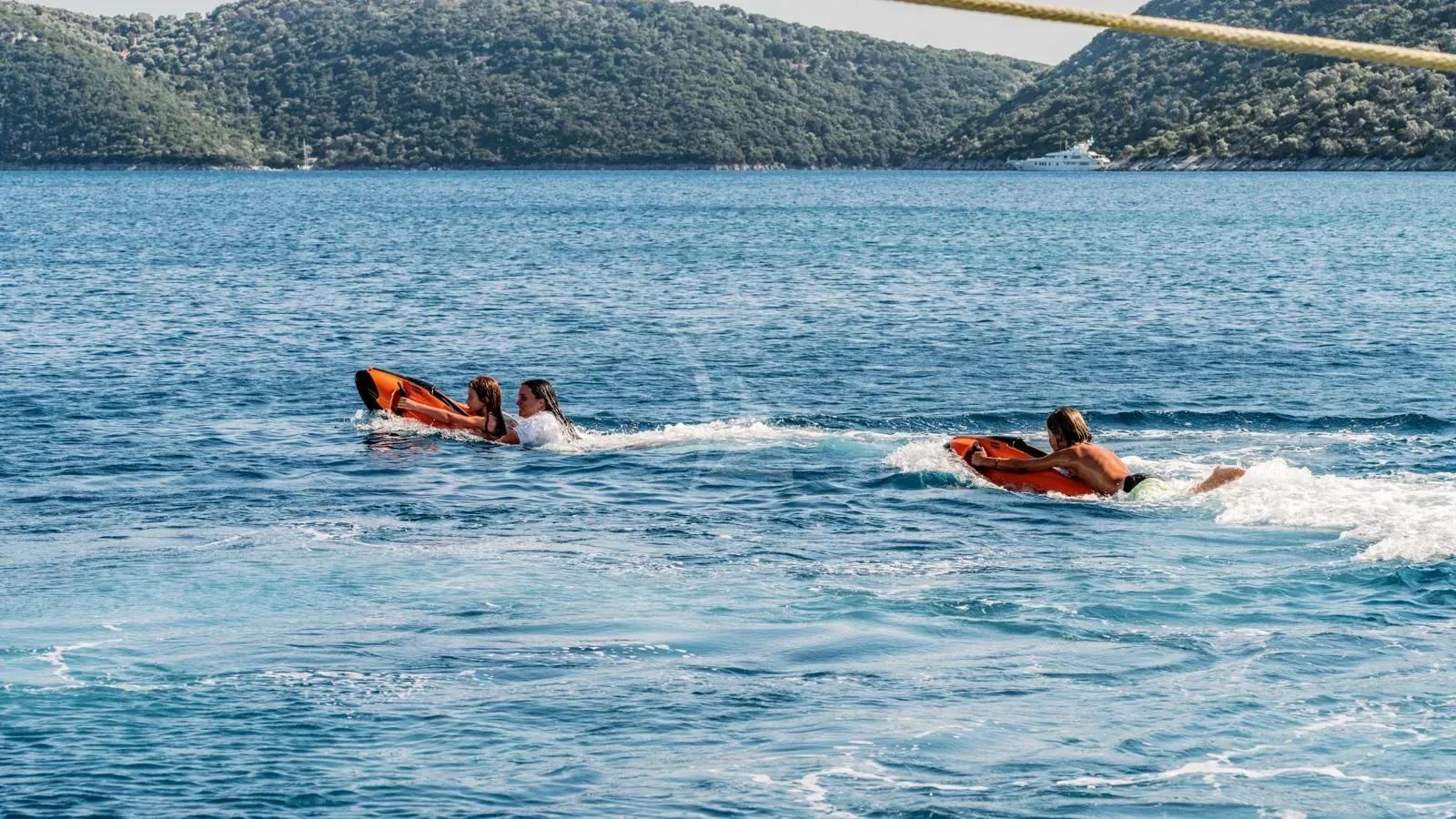 a couple of people in the water aboard AT ONE Yacht for Charter