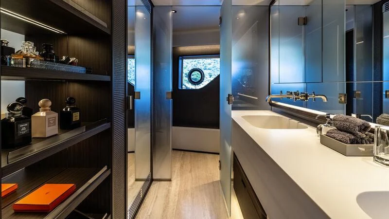 a bathroom with a sink and a mirror aboard AT ONE Yacht for Charter