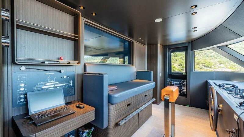 a room with a desk and a computer aboard AT ONE Yacht for Charter