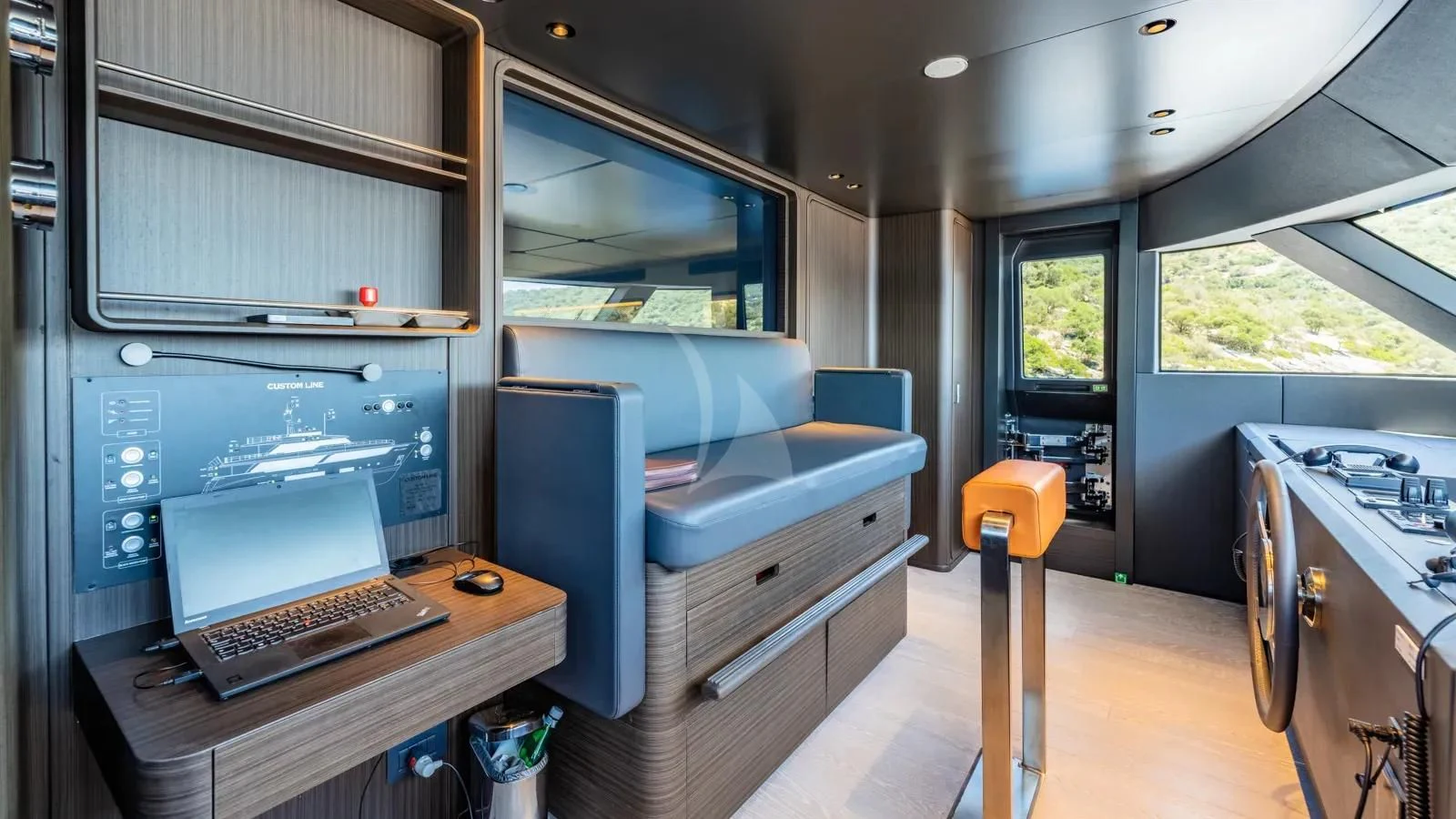 a room with a desk and a computer aboard AT ONE Yacht for Charter