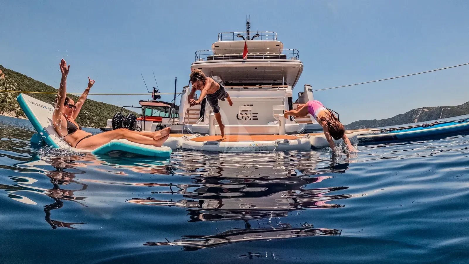 a group of people on a boat aboard AT ONE Yacht for Charter