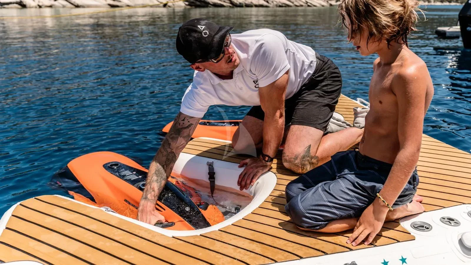 a couple of men on a boat aboard AT ONE Yacht for Charter