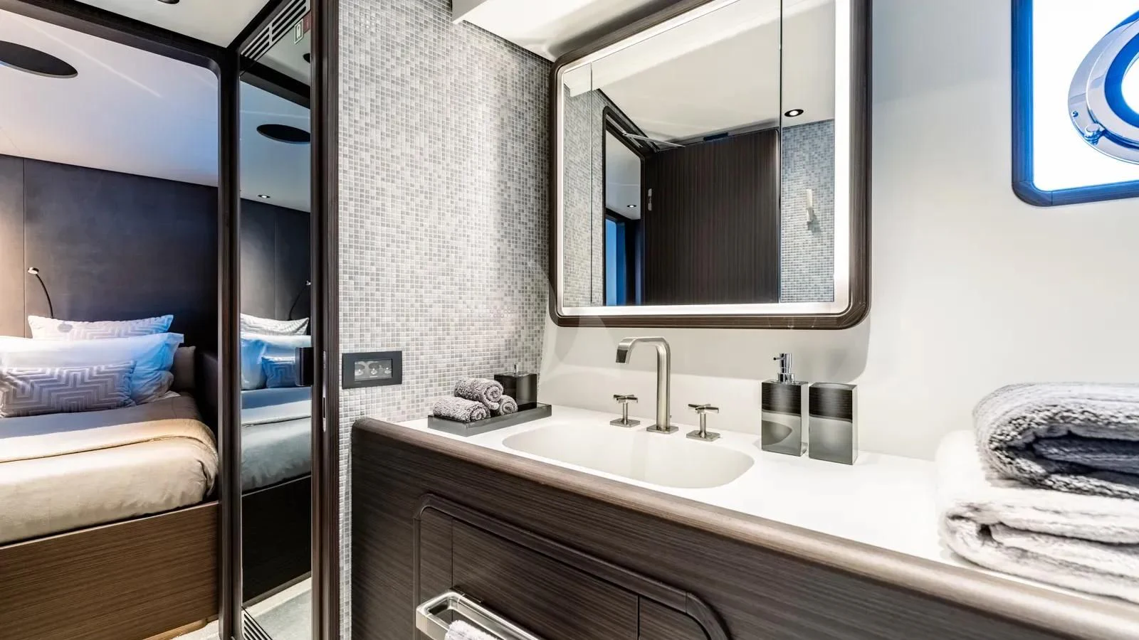 a bathroom with a sink and a mirror aboard AT ONE Yacht for Charter