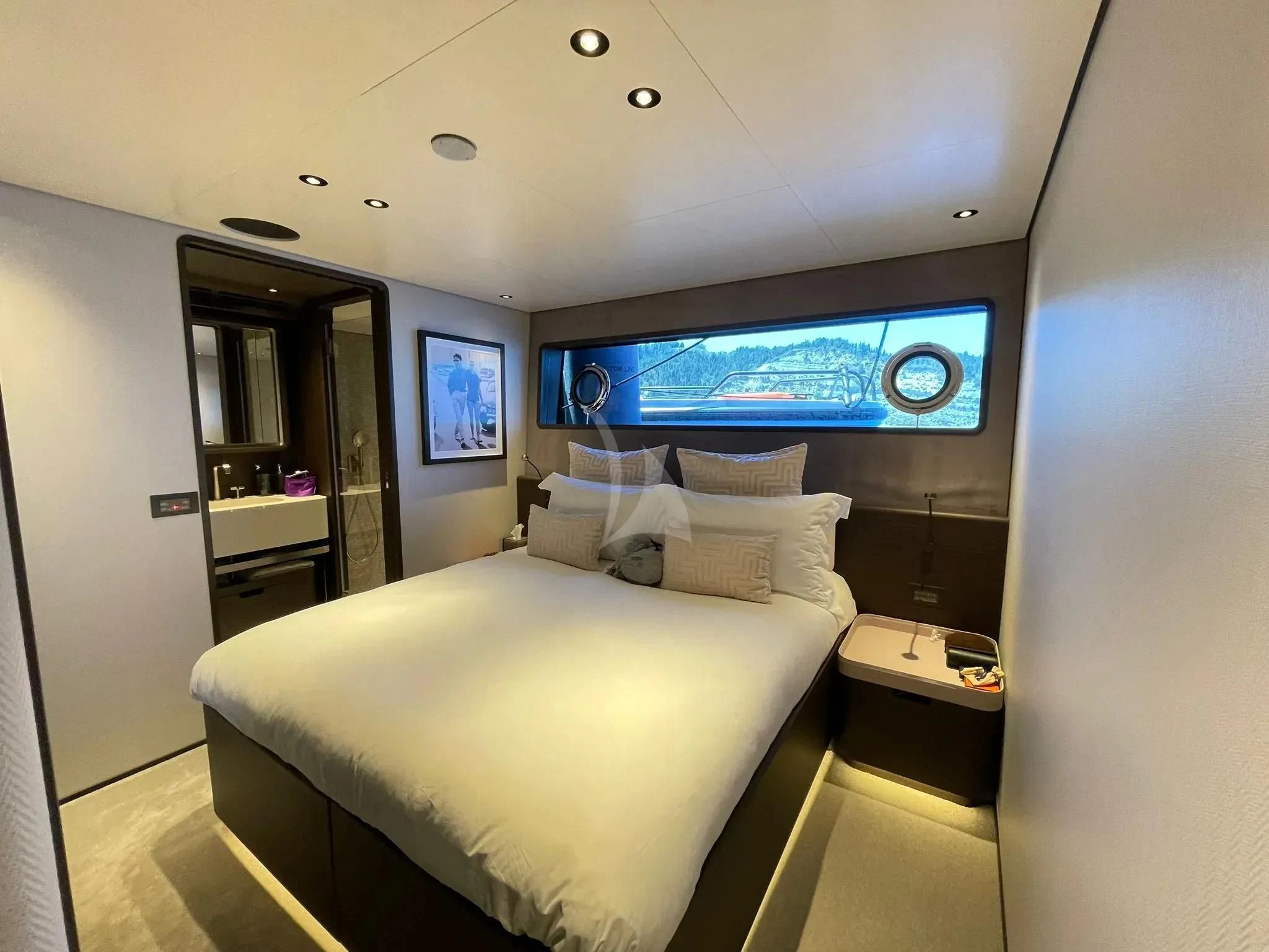 a bed in a room aboard AT ONE Yacht for Charter