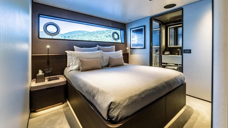 a bed in a room aboard AT ONE Yacht for Charter