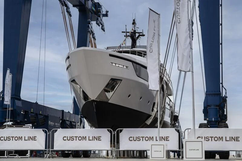 a large white boat on a dock aboard AT ONE Yacht for Charter