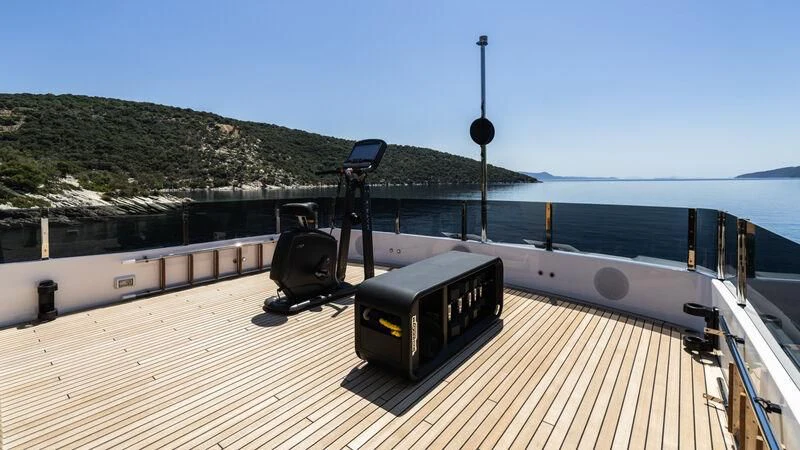 a train on a bridge aboard AT ONE Yacht for Charter