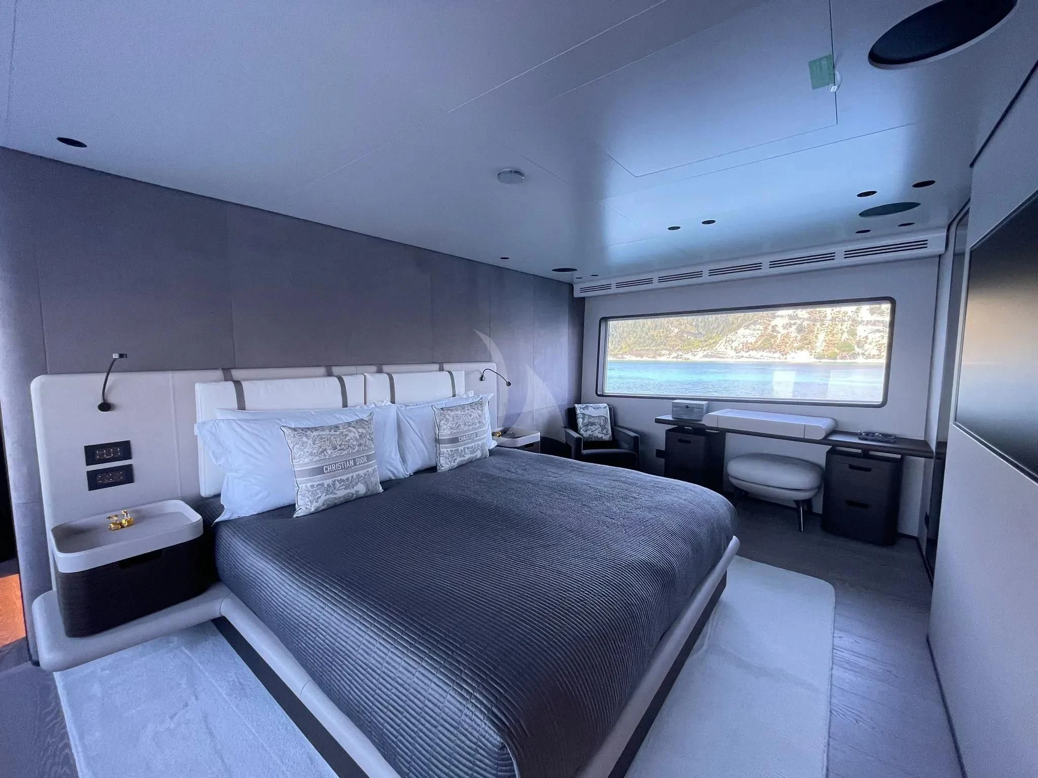 a bed in a room aboard AT ONE Yacht for Charter