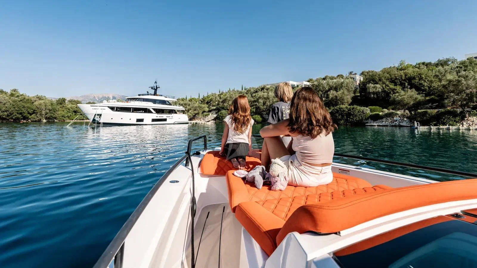 a group of people sitting on a boat in the water aboard AT ONE Yacht for Charter