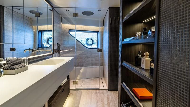 a bathroom with a large mirror aboard AT ONE Yacht for Charter
