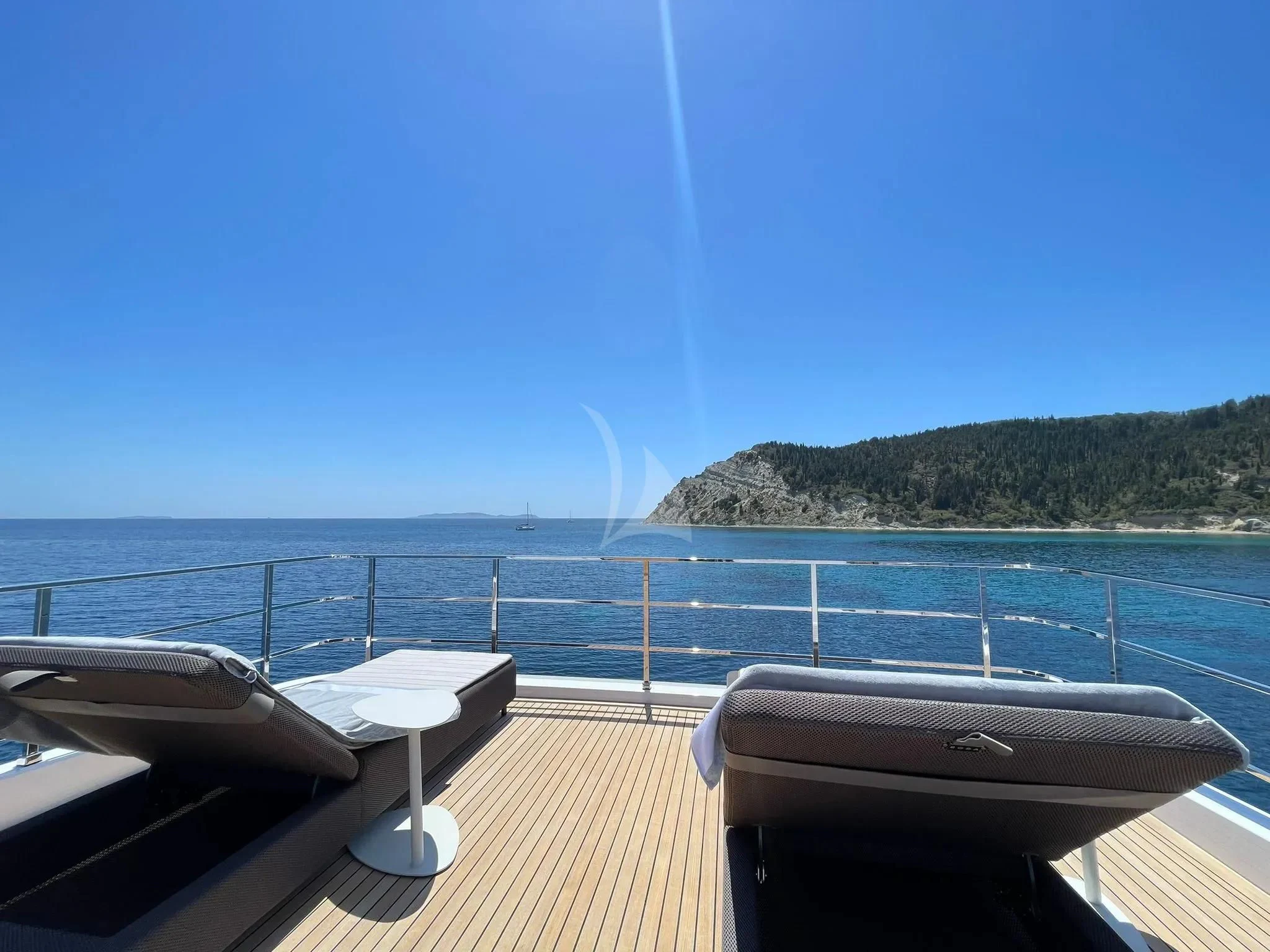 a deck overlooking the ocean aboard AT ONE Yacht for Charter